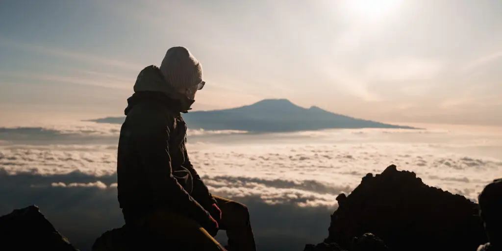 Kilimanjaro rising above clouds, viewed from Mount Meru at sunrise